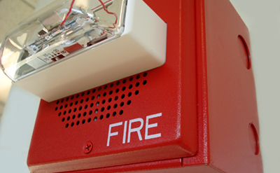 Fire alarm and flashing light in work setting