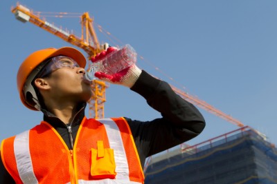 Construction worker drinking water 