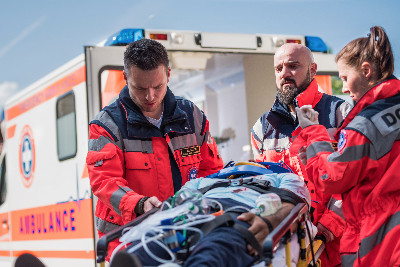 Paramedics treating a patient