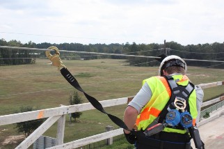 Worker wearing a harness and working at height