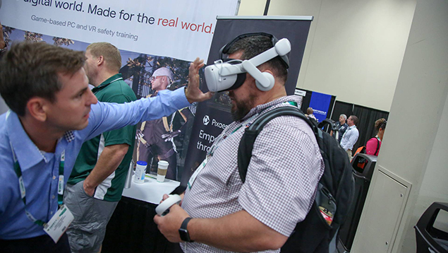 Safety professional testing virtual reality gear at exposition
