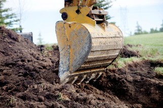 A backhoe digging a trench