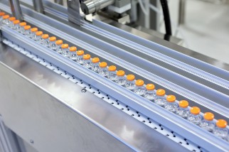 Glass medicine bottles on a conveyor belt 
