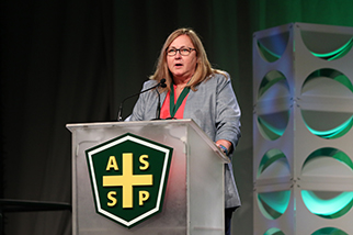 Christine Sullivan stands at podium at ASSP Professional Development Conference